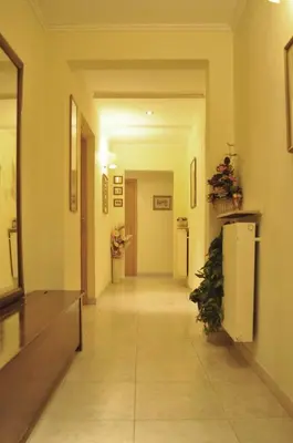a hallway of a building with a refridgerator at Hotel Fiorenza in Rome