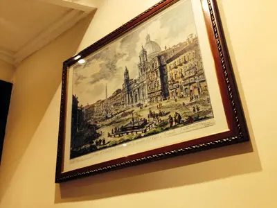 a picture of a painting of a city on a wall at Hotel Fiorenza in Rome