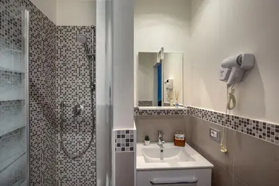 a bathroom with a sink and a shower at Prima Guest House Collection in Rome