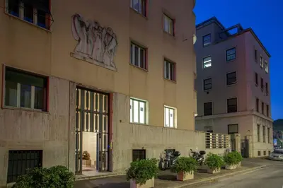 a building with a mural on the side of it at Prima Guest House Collection in Rome