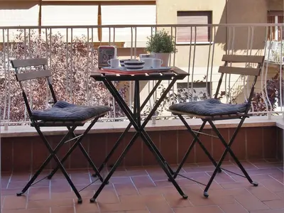 two chairs and a table on a balcony at Holiday in Rome in Rome