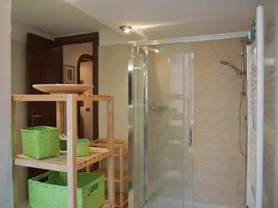 a bathroom with a shower with a glass shower stall at Holiday in Rome in Rome