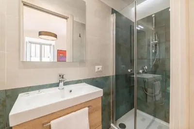a bathroom with a sink and a shower at Roma Station House in Rome