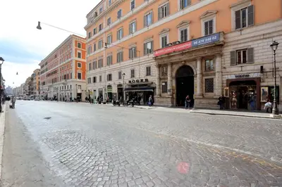 an empty street in a city with buildings at Guest House Amaranto Romano in Rome