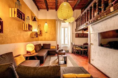 a living room with a couch and a table at La Scala in Rome
