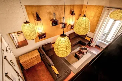 an overhead view of a living room with pendant lights at La Scala in Rome