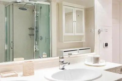 a bathroom with a sink and a shower at Frattina Royal in Rome