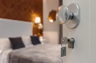 a bedroom with a bed with a light on the wall at Bed And Best in Rome
