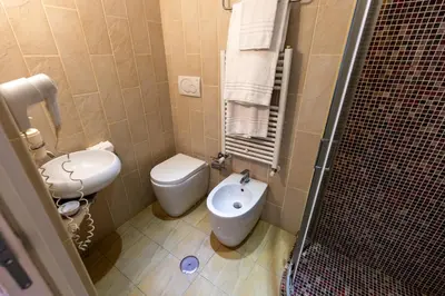 a small bathroom with a toilet and a bidet at Bed And Best in Rome