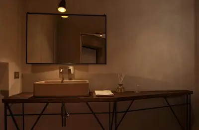 a bathroom with a sink and a mirror at The Place in Rome