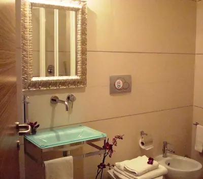 a bathroom with a sink and a mirror at Interno 5 B&B in Rome