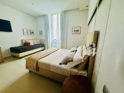 a bedroom with a large bed and a window at Interno 5 B&B in Rome