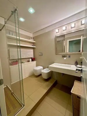 a bathroom with a toilet and a sink and a shower at Interno 5 B&B in Rome