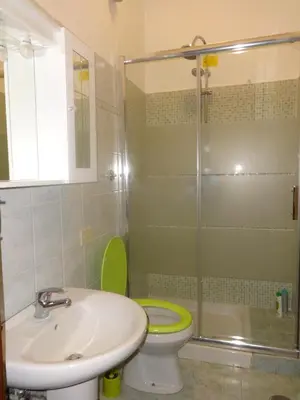 a bathroom with a toilet and a sink and a shower at B&B Twins in Rome