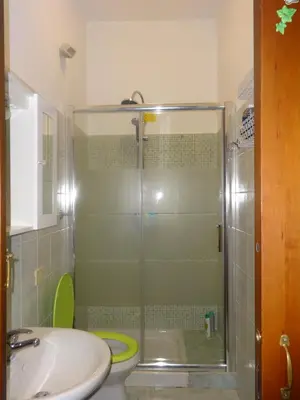 a bathroom with a shower and a toilet and a sink at B&B Twins in Rome
