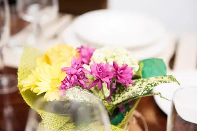 a bouquet of colorful flowers in a glass vase at AmoRoma Francesca in Rome