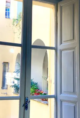 a window with a view of a building at Le Rondini a Roma in Rome