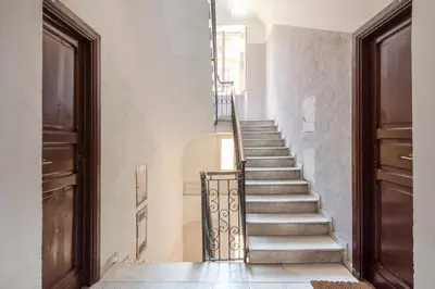 a staircase in a house with a stair case at Casa Camilla in Rome