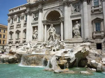 a building with a fountain in front of a building at Casa Camilla in Rome