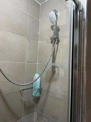 a shower with a blow dryer in a shower at Kobe's Apartment in Rome
