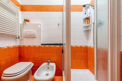 a bathroom with a toilet and a sink at Apartment Angelo Emo 69 in Rome