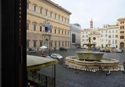a view of a street with a fountain in a city at Farnese 48 in Rome
