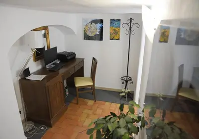 an office with a desk with a computer and a chair at Farnese 48 in Rome