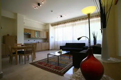 a living room with a couch and a table at Lux Appartamenti in Rome