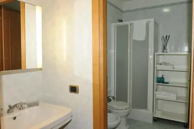 a bathroom with a toilet and a sink at Lux Appartamenti in Rome