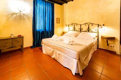 a bedroom with a bed with two towels on it at maison specchi in Rome