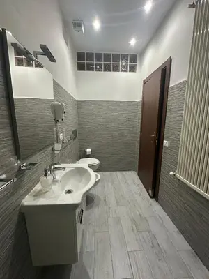 a bathroom with a sink and a toilet at Royal Termini in Rome