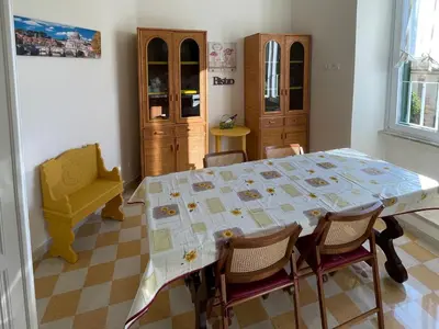 a dining room with a table and chairs at Domus Claudia San Giovanni in Rome