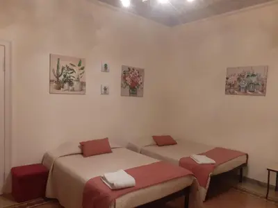 a room with two beds in a room at Domus Claudia San Giovanni in Rome