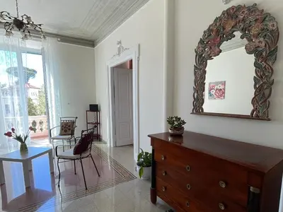 a room with a dresser and a mirror on the wall at Domus Claudia San Giovanni in Rome