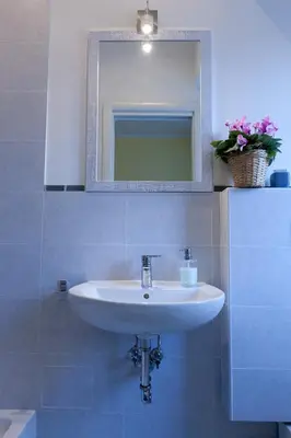 a bathroom with a sink and a mirror at Marco Polo Vatican APARTMENT Metro A 2 min - San Pietro 10 min in Rome