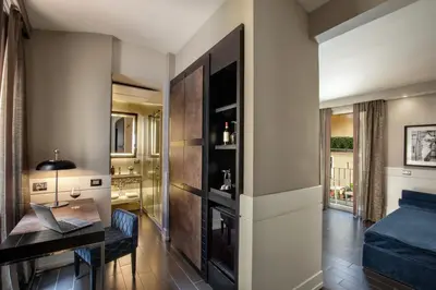 a living room with a desk and a bed at The Style in Rome