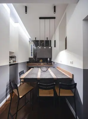 a dining room with a table and chairs in a kitchen at colosseo flats and penthouse in Rome