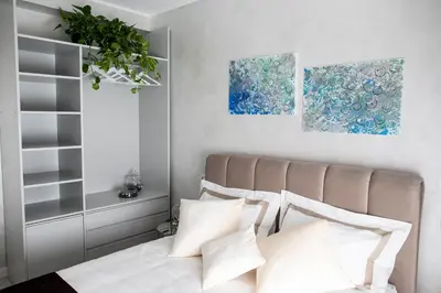a bedroom with a bed with white pillows at Il Magnificus Boutique in Rome