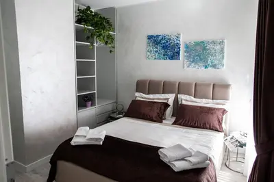 a bedroom with a bed with two towels on it at Il Magnificus Boutique in Rome