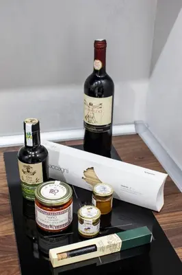 a box with two bottles of wine and paint brushes at Il Magnificus Boutique in Rome