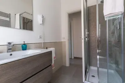a bathroom with a sink and a shower at La Casa di Anto - San Giovanni in Rome