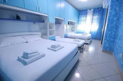 a bedroom with two beds with towels on them at Marco Aurelio in Rome