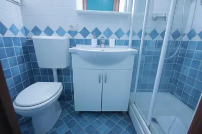 a bathroom with a toilet and a sink and a shower at Marco Aurelio in Rome
