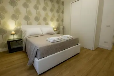a bedroom with a bed with two towels on it at Suite Pinturicchio in Rome