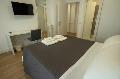 a bedroom with a large bed with towels on it at Suite Pinturicchio in Rome