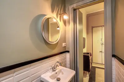 a bathroom with a sink and a mirror at Trastevere San Cosimato vintage in Rome