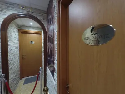 a bathroom with a doorway sign on the door at Il Gladiatore in Rome
