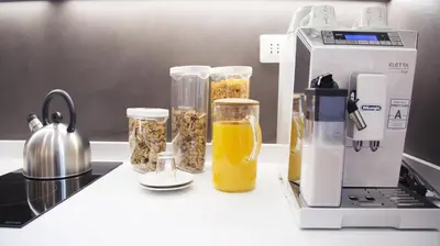 a kitchen counter with a blender and four jars of food at Suite Inn Rome in Rome