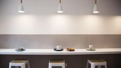 a counter with two stools and two plates of food at Suite Inn Rome in Rome