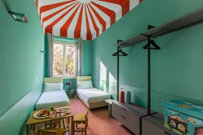 a bedroom with two beds and a red and white ceiling at ROMAC Mazzini with 5 bedrooms near the Vatican in Rome